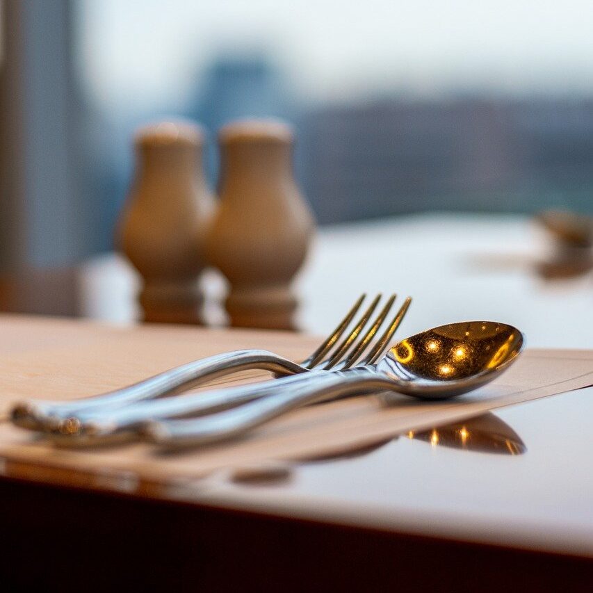 dining table, restaurant, utensils